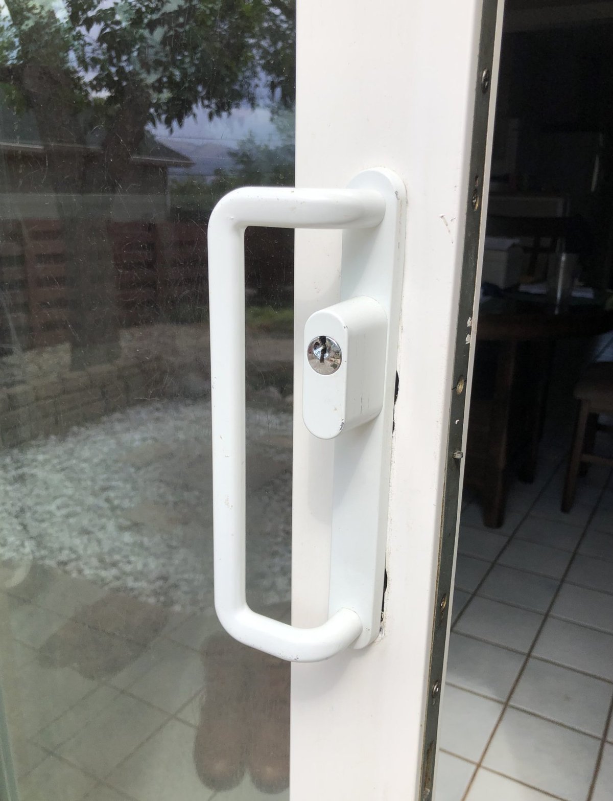 Sliding door lock and handle with key cylinder serviced by Smooth Slide in South Florida