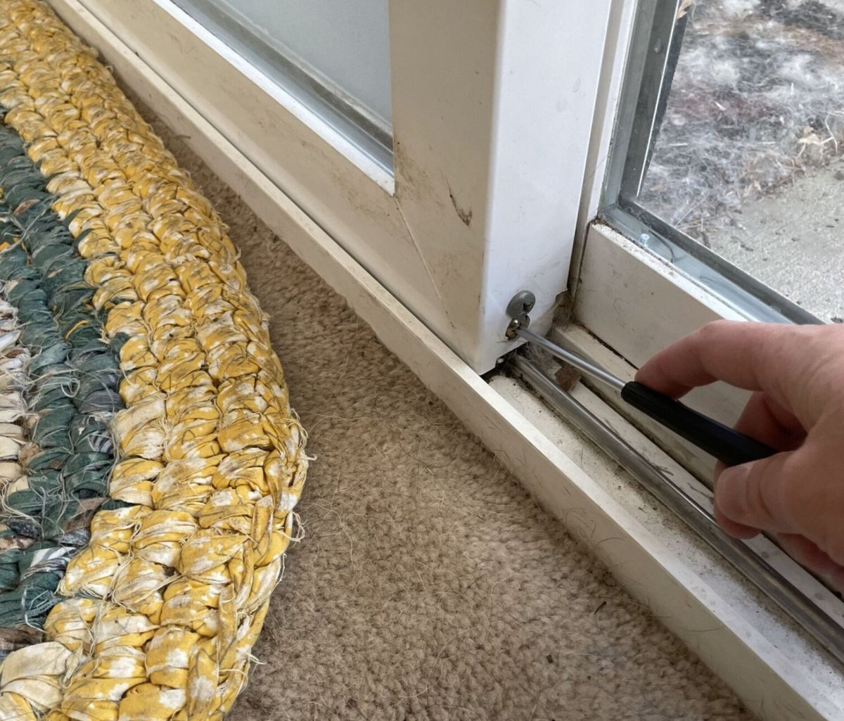 Sliding door roller height adjustment for proper alignment